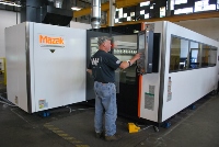 Employee operating Mazak laser